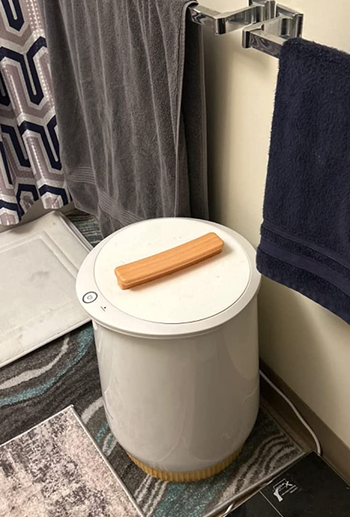 the white towel warmer in a reviewer's bathroom