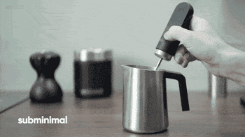 GIF of someone using the frother with the words 