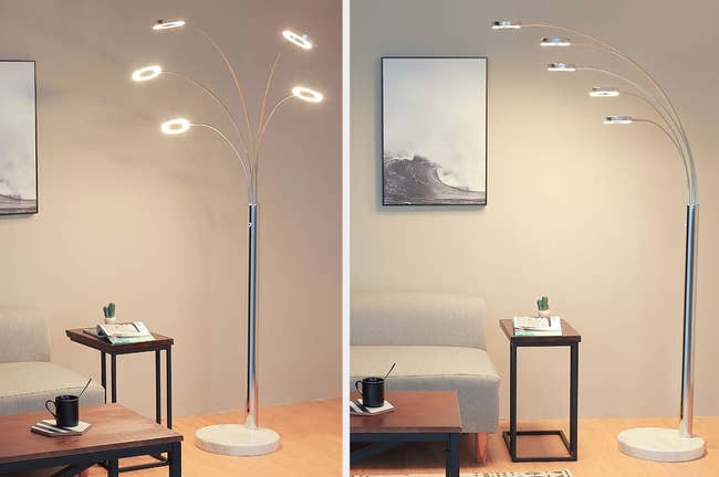 Silver and white floor lamp with five branch lights next to a brown side table on hardwood floor, product with lights lined on top of one another next to side table