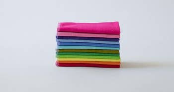 a rainbow stack of cloths