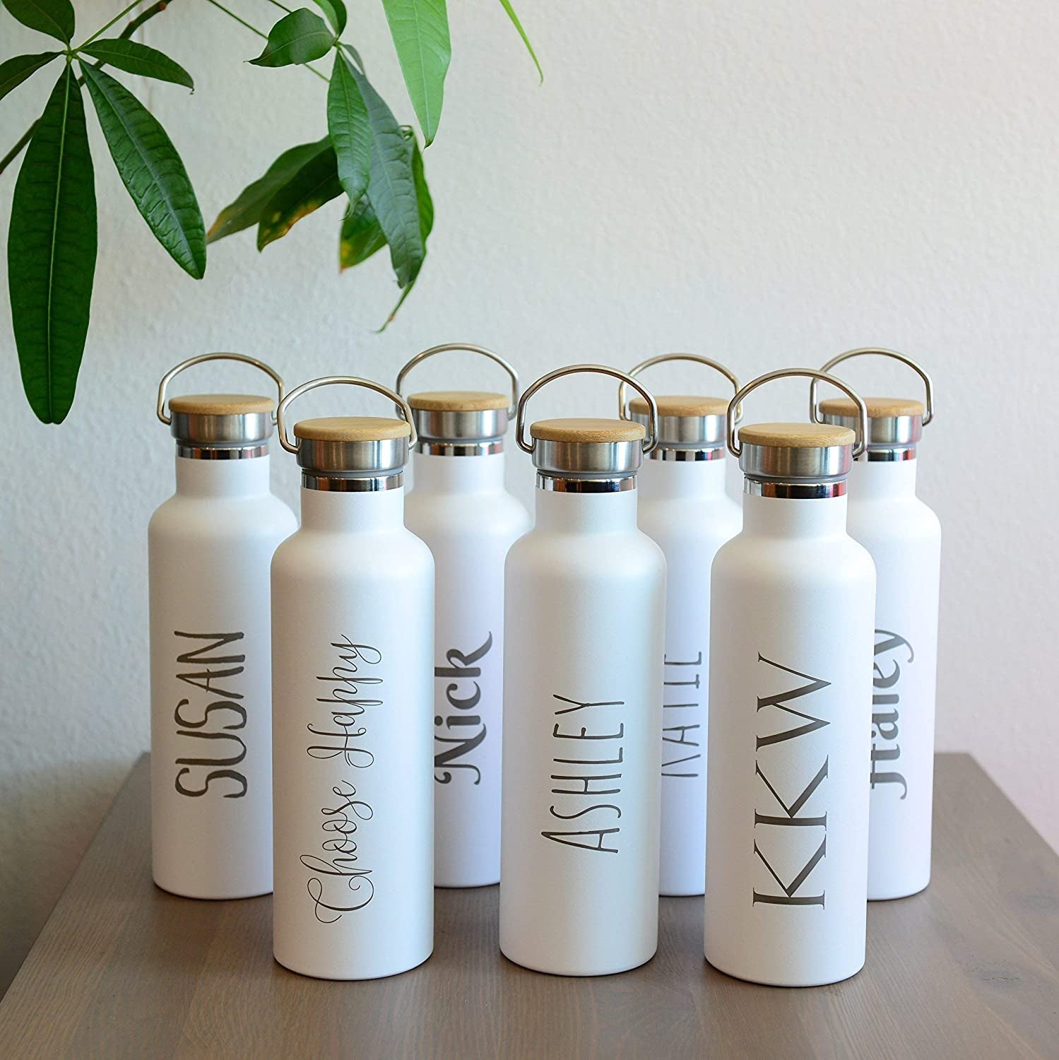various water bottles with different text in different fonts