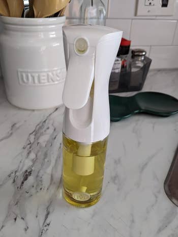 Oil spray vessel  connected  room  antagonistic  adjacent   utensils and spices. Ideal for adjacent    organisation  portion    cooking