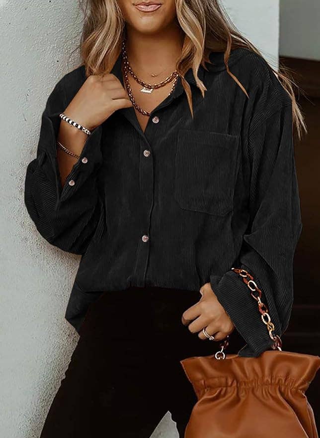a model in a black oversized corduroy top