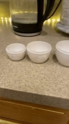reviewer gif of the six measuring cups in the set lined up on a counter