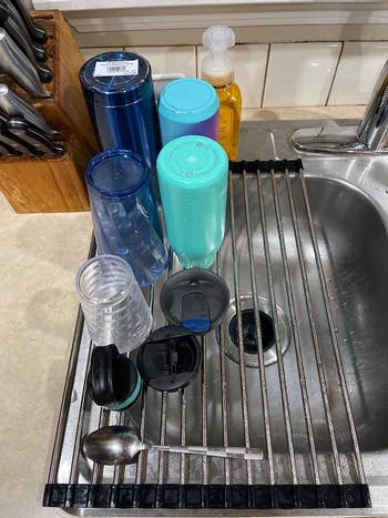 a reviewer utilizing the rack for dishes