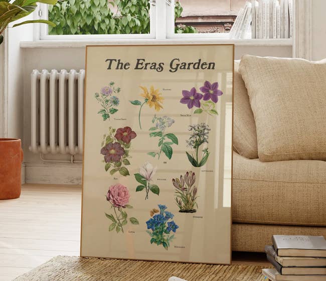 the eras garden poster in a frame in a living room