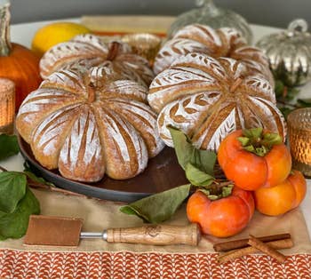 reviewer bread loaves designed to look like pumpkins with scoring tool in front