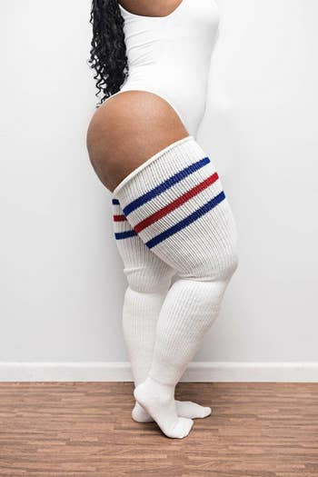 model wearing the white socks with stripes