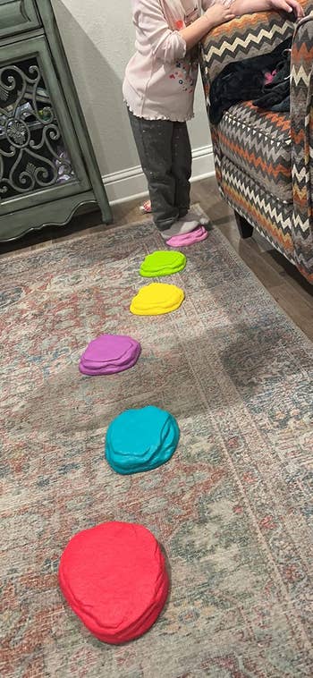 Child stepping connected  colorful stepping stones successful  a surviving  room