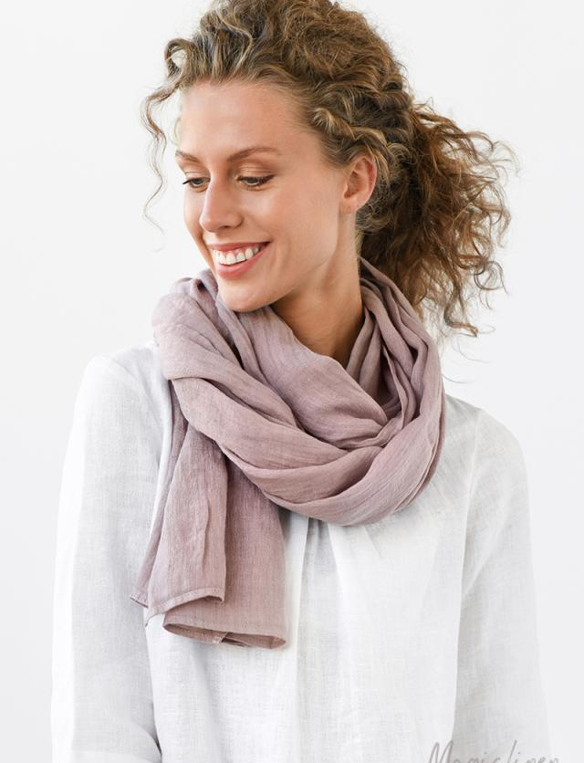 Model wearing the woodrose colored scarf with white linen top