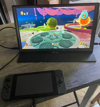 a nintendo switch connected to the monitor