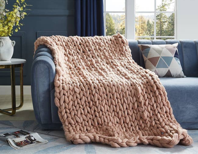 large blush knit throw on couch