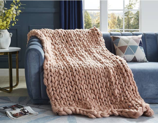 large blush knit throw on couch