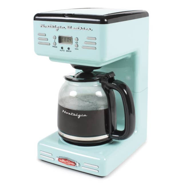 A pale light blueish green coffee brewing system with a coffee pot that has 