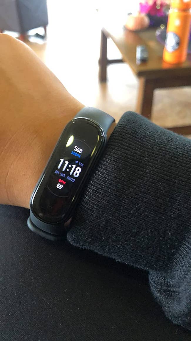 Reviewer wearing tracker on their wrist