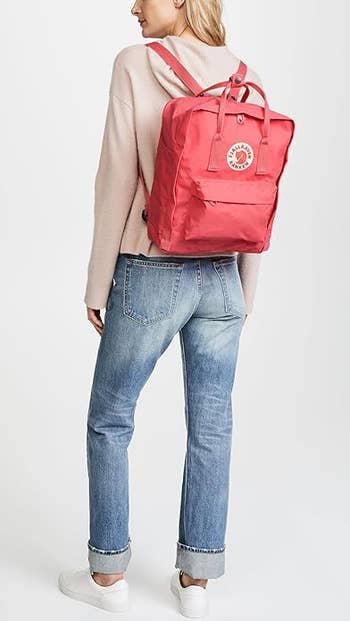 model wearing the backpack in pink
