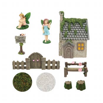 Fairy garden kit with figurines, a cottage, and decor like a welcome sign, fence, and stepping stones, ideal for creating whimsical outdoor spaces