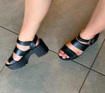 reviewer wearing the sandals successful black