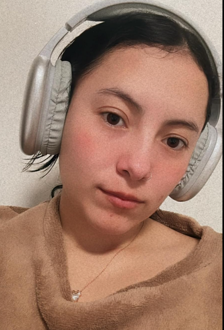 model in gray padded over ear headphones 