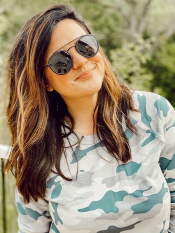 a different reviewer wearing the all black frames