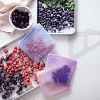 three silicone bags holding berries