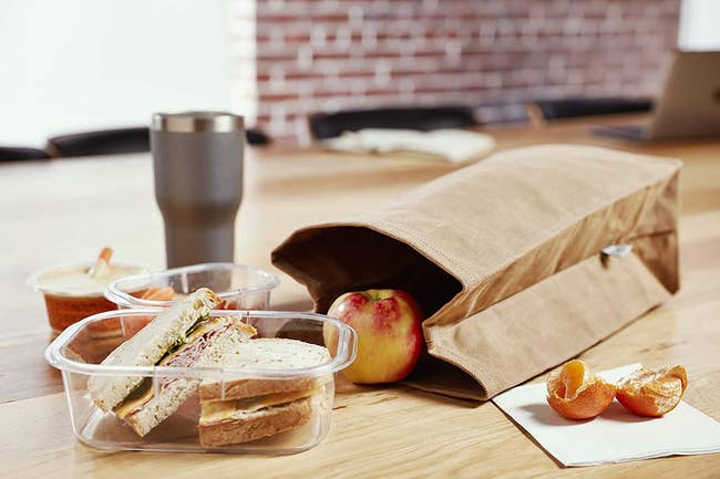 reusable brown bags with lunch inside of it