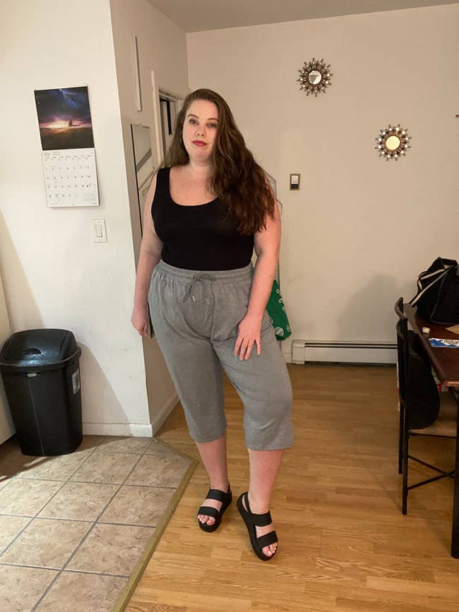 A reviewer wearing the pants indoors
