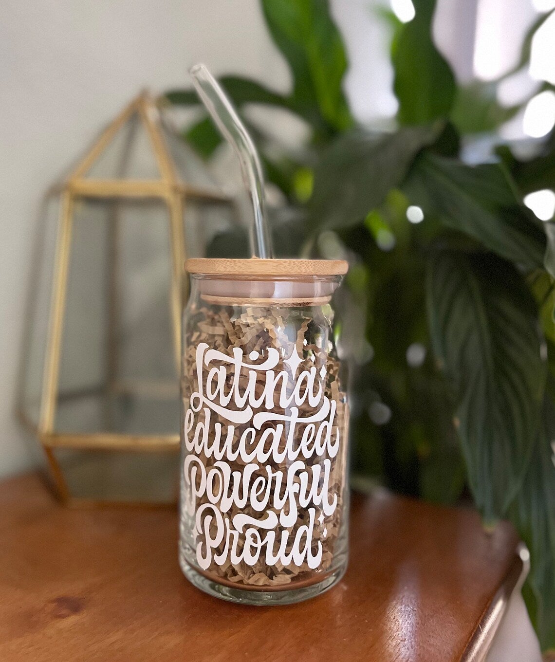 a clear glass cup that reads