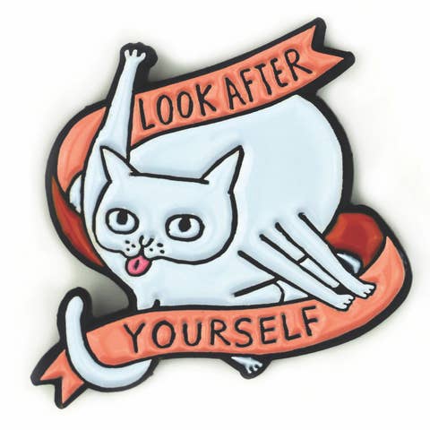 enamel pin of white cat licking its butt with text 
