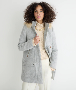 A model wearing the parka in heather gray