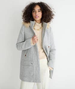 A model wearing the parka in heather gray