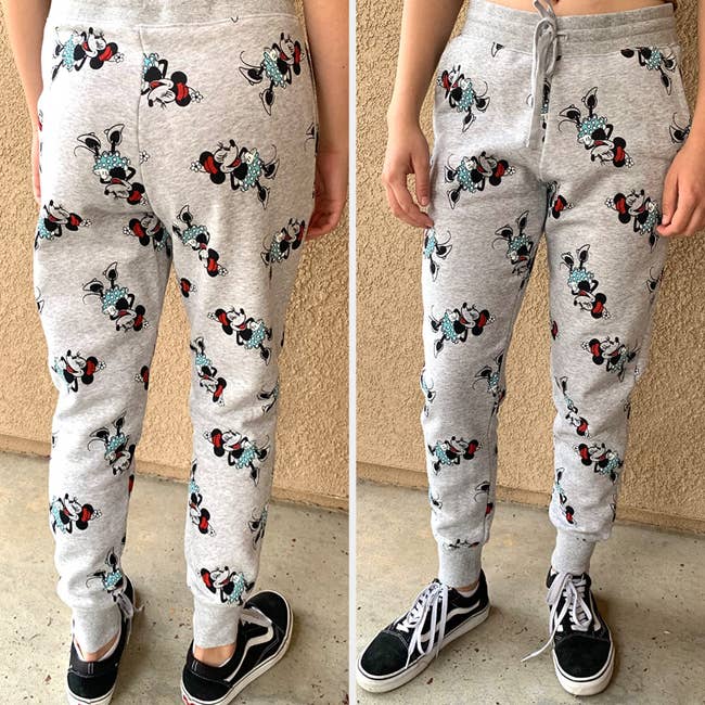 a reviewer wearing gray joggers with minnie mouse printed on them