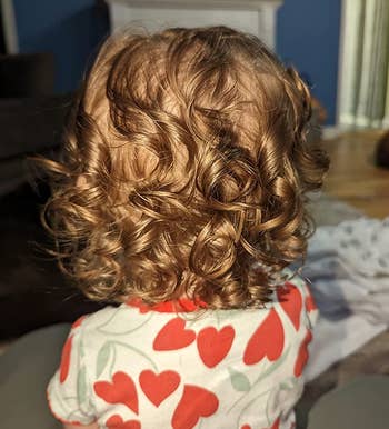 image of another reviewer's child with healthy looking curly hair