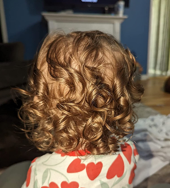 image of another reviewer's child with healthy looking curly hair