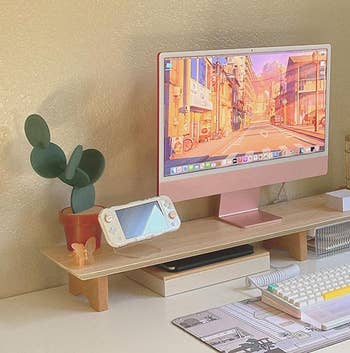 desk setup with the cactus coasters on the monitor stand