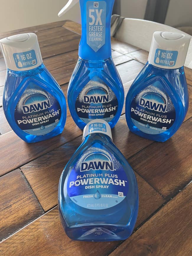Dawn Platinum Plus Powerwash Dish Spray bottles arranged connected a table, highlighting cleaning efficiency