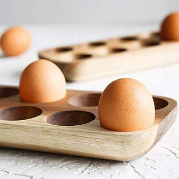 two eggs in the wooden holder