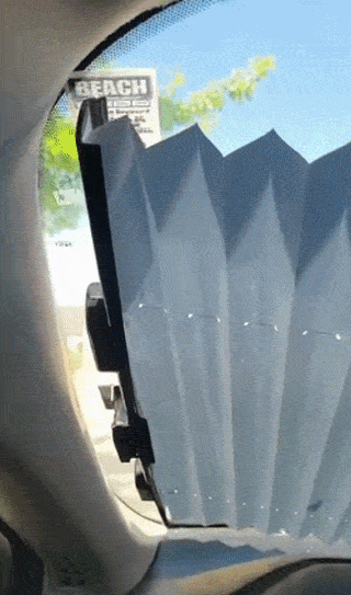 A reviewer using the retractable sun shade