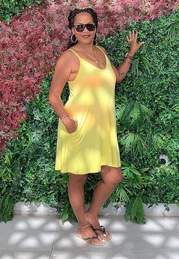 reviewer in yellow tank dress 