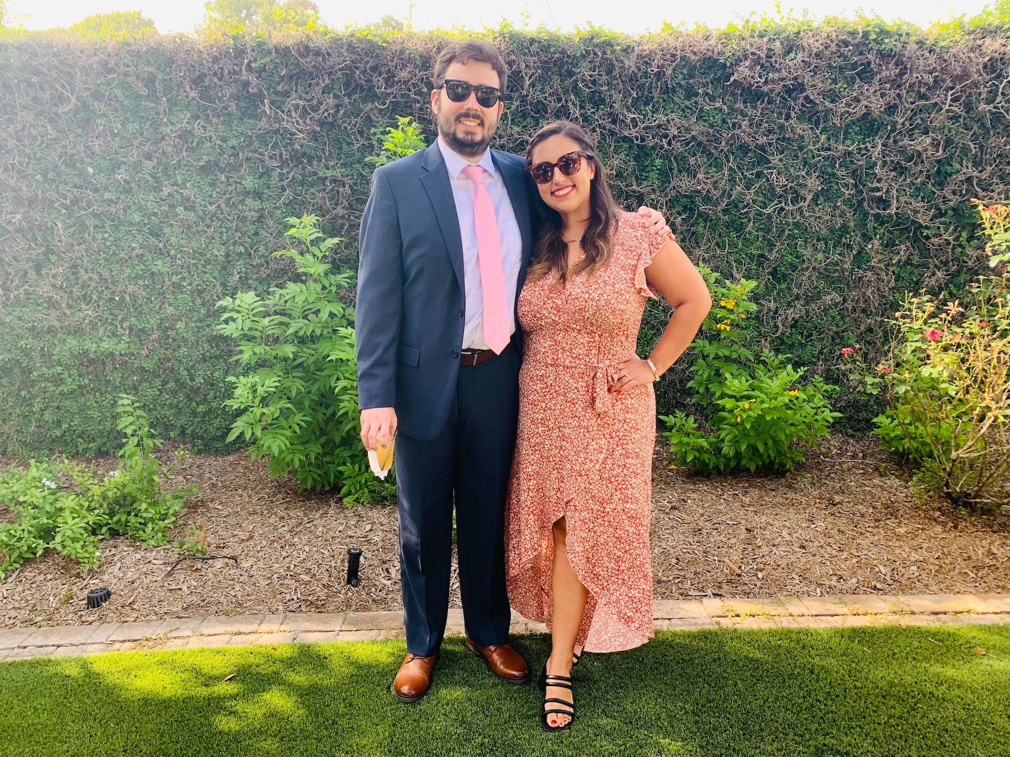 writer wearing orange dress and black heels