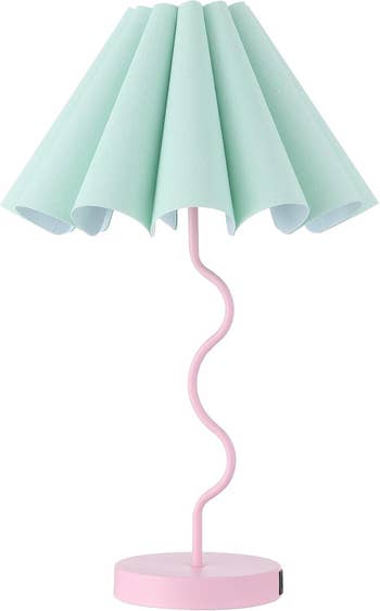 Stylish array  lamp with a wavy pinkish  basal  and a pleated shade, perfect  for modern   location  decor