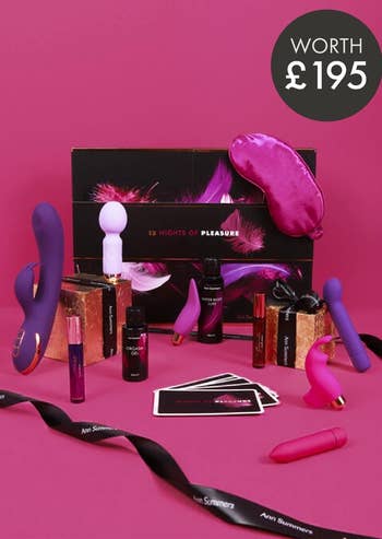 Black and pink advent calendar with assorted sex toys and accessories in front