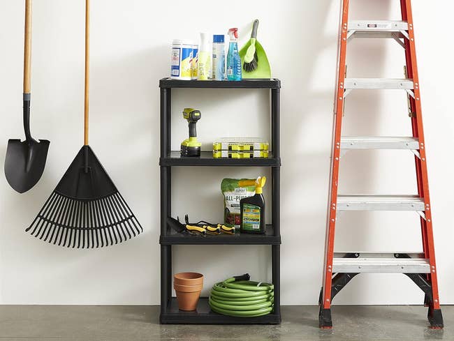 A variety of cleaning tools and supplies organized neatly on a shelving unit