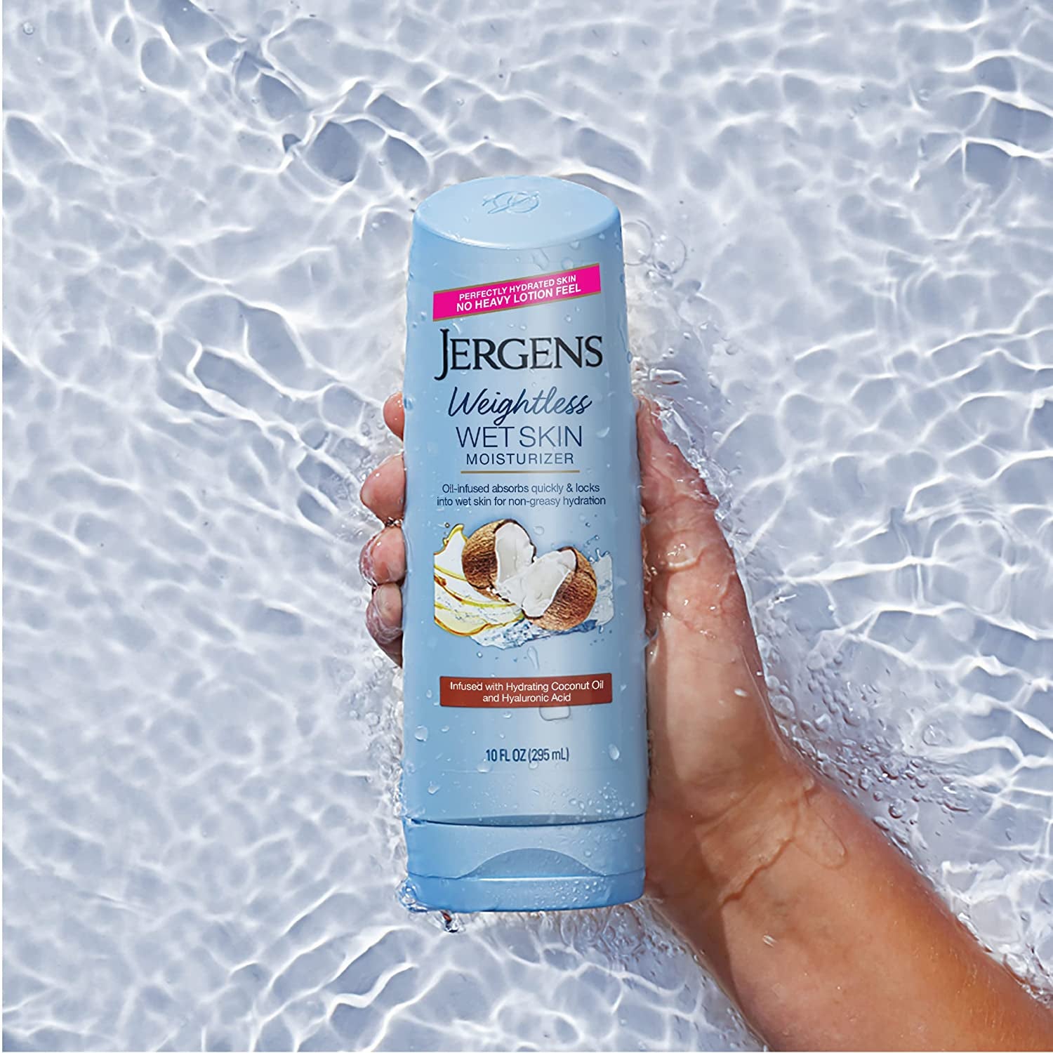 A model holding a bottle of the lotion in water