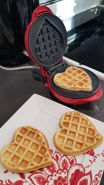 Reviewer's waffle maker with heart shaped waffle in it