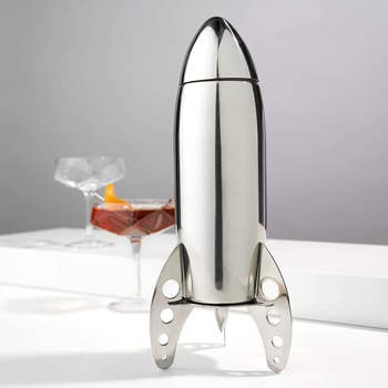 THe rocket shaped shaker on a table 