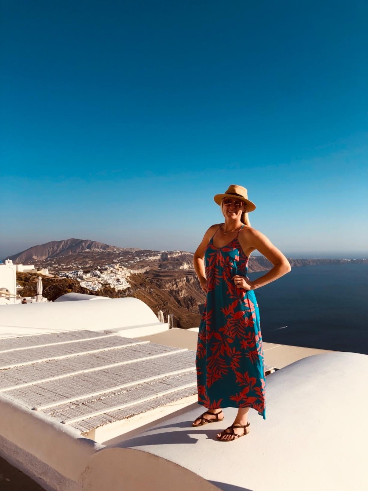 reviewer wearing the sandals with a maxi dress
