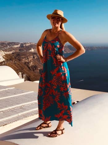 reviewer wearing the sandals with a maxi dress