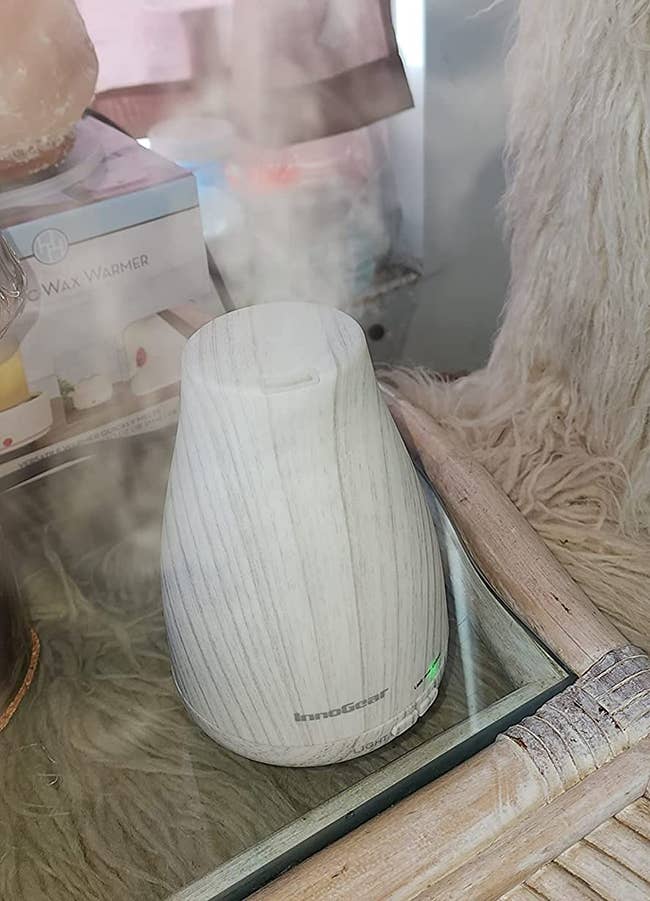 the faux white wood design diffuser emitting mist