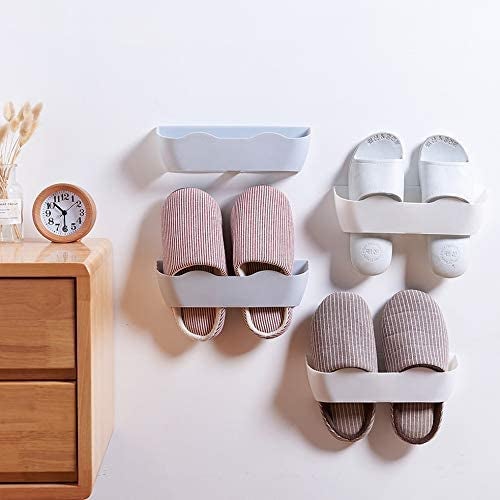 three pairs of slippers hung in wall-mounted organizers 